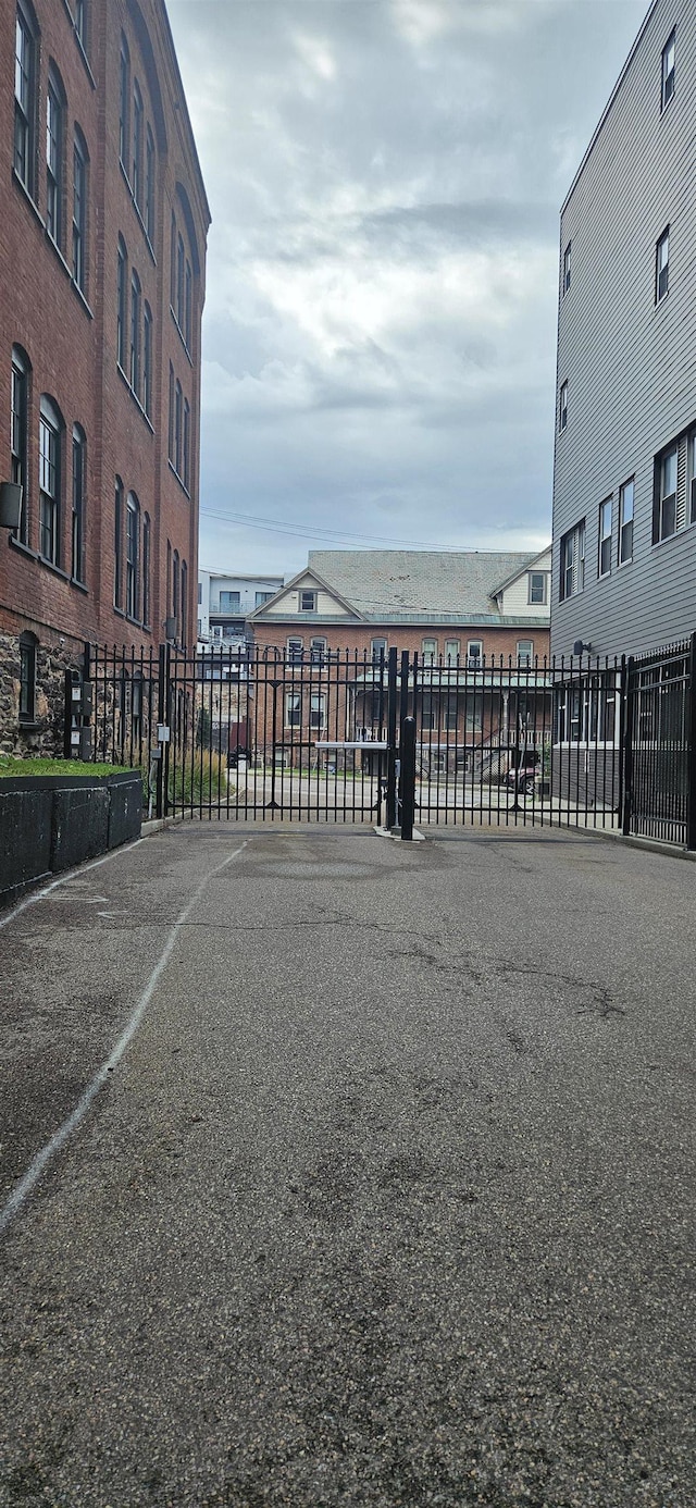 161 St Paul St Unit 001, Burlington, VT 05401 - view of parking featuring fence