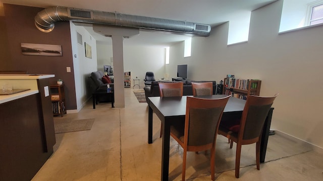 161 St Paul St Unit 001, Burlington, VT 05401 - dining area with concrete flooring and baseboards