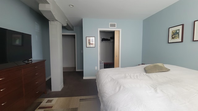 161 St Paul St Unit 001, Burlington, VT 05401 - carpeted bedroom featuring a spacious closet, baseboards, and a closet