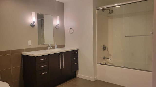161 St Paul St Unit 001, Burlington, VT 05401 - bathroom featuring tile patterned floors, vanity, shower / bath combination with glass door, and baseboards