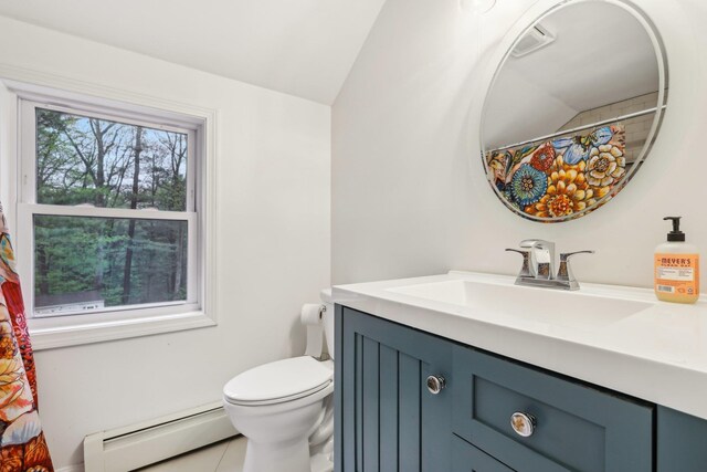 bathroom featuring a baseboard heating unit, toilet, vaulted ceiling, vanity, and tile patterned floors