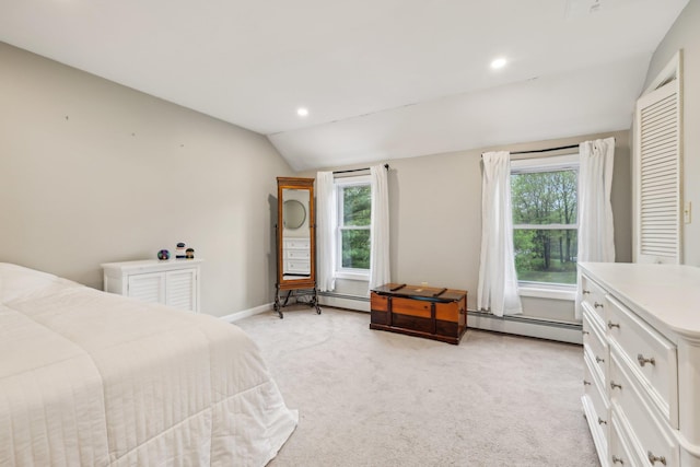 bedroom featuring a baseboard heating unit, lofted ceiling, light carpet, multiple windows, and baseboards