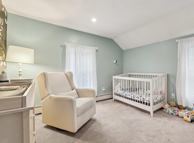 carpeted bedroom featuring a baseboard radiator, vaulted ceiling, and a crib