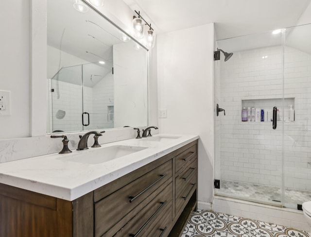 full bathroom with tile patterned floors, double vanity, a shower stall, lofted ceiling, and toilet