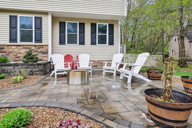 view of patio featuring a fire pit
