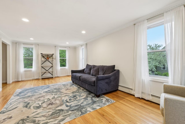 living area with light wood-style flooring, recessed lighting, and ornamental molding