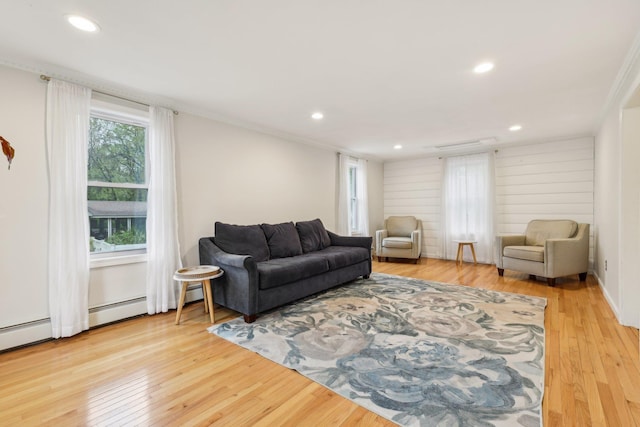living room with wood finished floors and recessed lighting