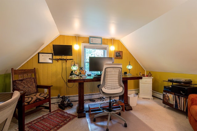 carpeted office space featuring baseboard heating, lofted ceiling, a baseboard radiator, and wood walls