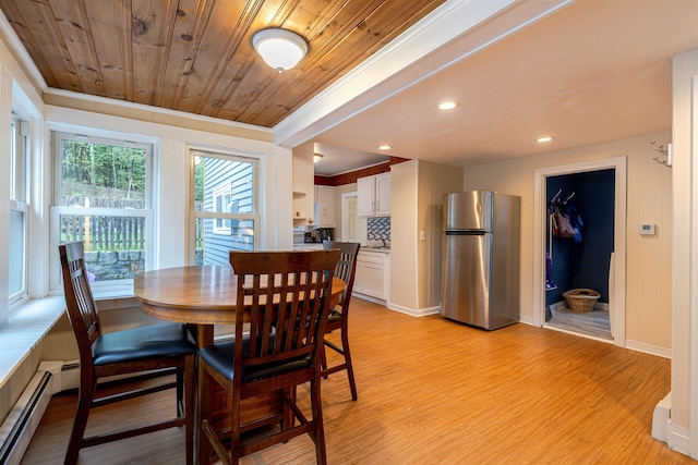 dining area with light wood finished floors, a baseboard heating unit, wooden ceiling, and recessed lighting