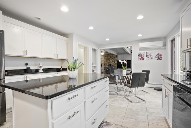 15 Roosevelt Dr, Bedford, NH 03110 - kitchen with dishwasher, a wall mounted air conditioner, a baseboard heating unit, recessed lighting, and white cabinets