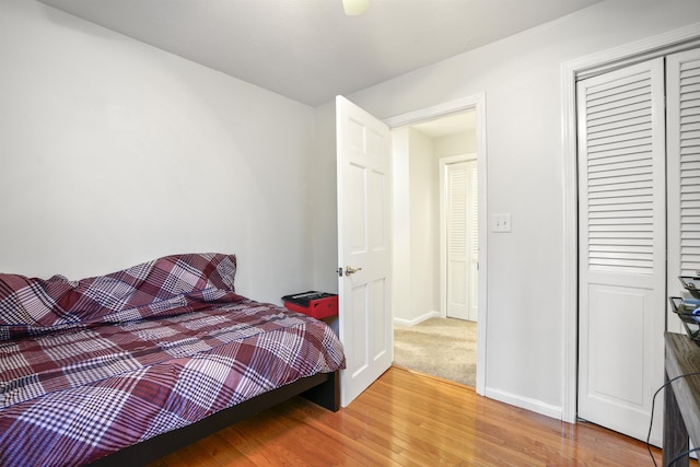 15 Roosevelt Dr, Bedford, NH 03110 - bedroom with wood finished floors, a closet, and baseboards
