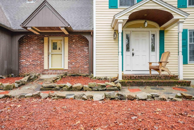 15 Roosevelt Dr, Bedford, NH 03110 - doorway to property with brick siding and a shingled roof