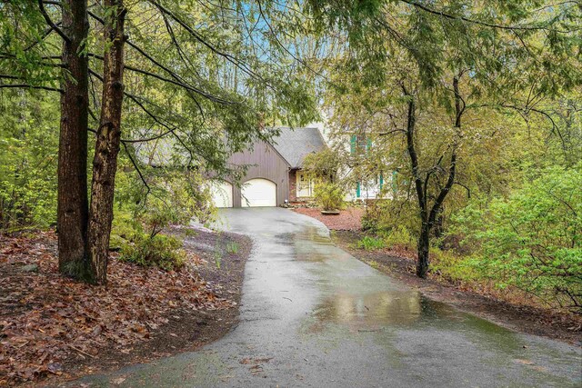 15 Roosevelt Dr, Bedford, NH 03110 - view of front of home with driveway and an attached garage
