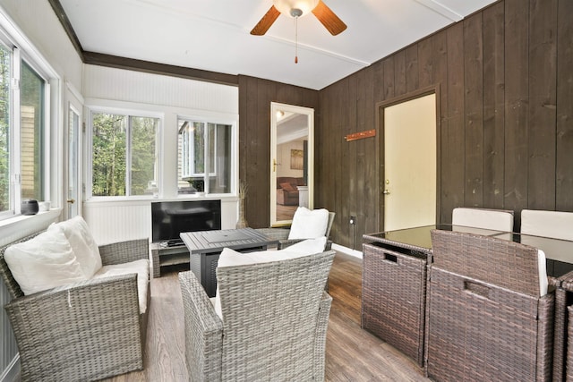 15 Roosevelt Dr, Bedford, NH 03110 - sunroom with wooden walls, a deck, and wood finished floors