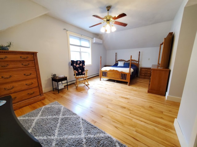 bedroom with a wall unit AC, lofted ceiling, light wood finished floors, a baseboard radiator, and a ceiling fan