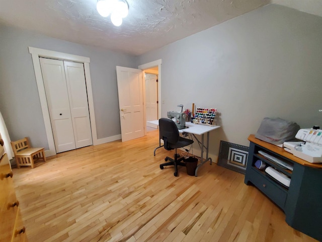 home office with light wood-type flooring