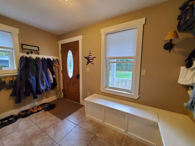 foyer entrance with light tile patterned flooring