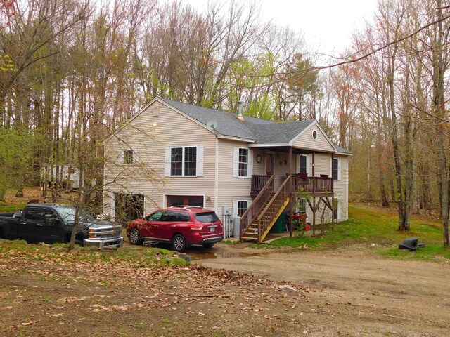 view of front of home featuring stairway