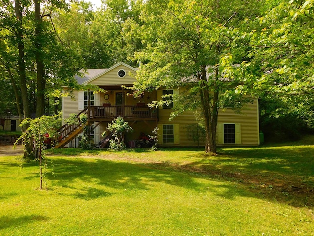 218 Deboer Ln, Wakefield, NH 03872 - view of front of house with stairs, a front yard, and a porch