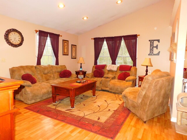 living area with wood finished floors, vaulted ceiling, and recessed lighting