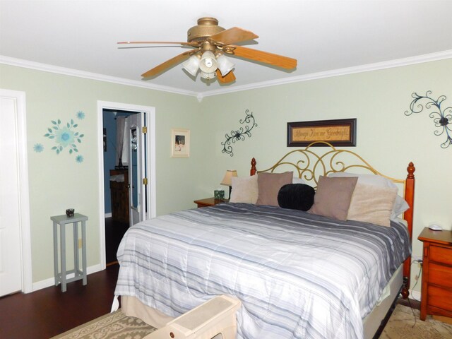 bedroom with ornamental molding, ceiling fan, wood finished floors, and baseboards