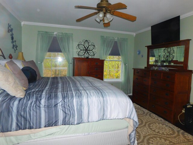 bedroom with crown molding and a ceiling fan