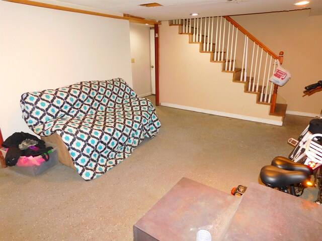 recreation room with baseboards
