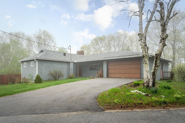 113 Watchtower Rd, Hopkinton, NH 03229 - view of front of home featuring driveway, an attached garage, a chimney, and fence