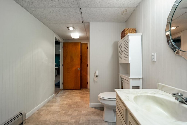 113 Watchtower Rd, Hopkinton, NH 03229 - bathroom with a baseboard radiator, baseboards, toilet, a drop ceiling, and vanity