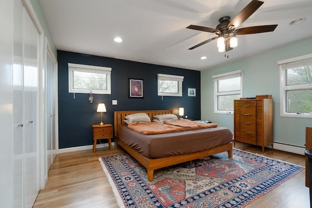 113 Watchtower Rd, Hopkinton, NH 03229 - bedroom featuring baseboard heating, light wood-type flooring, recessed lighting, baseboards, and ceiling fan