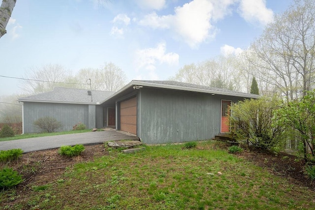 113 Watchtower Rd, Hopkinton, NH 03229 - rear view of house with asphalt driveway and a garage