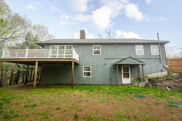 113 Watchtower Rd, Hopkinton, NH 03229 - back of property featuring a deck, a chimney, and a lawn