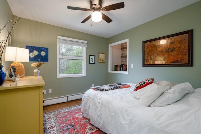 113 Watchtower Rd, Hopkinton, NH 03229 - bedroom with a baseboard radiator, wood finished floors, and ceiling fan