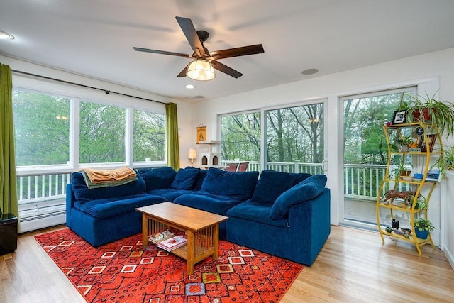 113 Watchtower Rd, Hopkinton, NH 03229 - living area with a baseboard radiator, wood finished floors, and ceiling fan