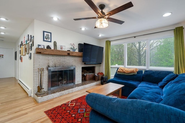113 Watchtower Rd, Hopkinton, NH 03229 - living area featuring baseboard heating, a brick fireplace, light wood-type flooring, ceiling fan, and recessed lighting