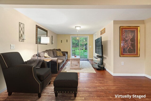 living room featuring wood finished floors and baseboards