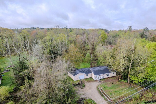 view from above of property featuring a forest