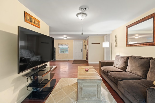 living area featuring wood finished floors and baseboards