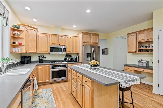 kitchen with open shelves, appliances with stainless steel finishes, a sink, a kitchen breakfast bar, and dark countertops