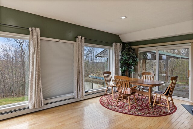 331 Gilman Rd, Sheldon, VT 05450 - dining space featuring a baseboard heating unit, lofted ceiling, wood-type flooring, and recessed lighting