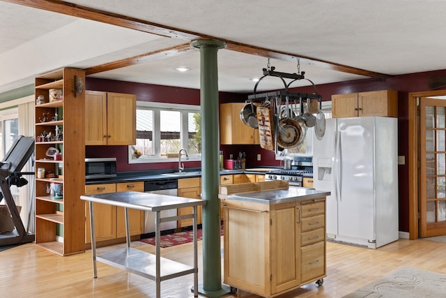 331 Gilman Rd, Sheldon, VT 05450 - kitchen featuring stainless steel appliances, a sink, light wood-type flooring, a kitchen island, and open shelves