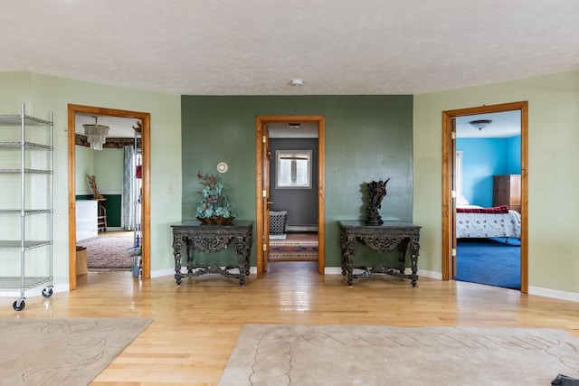 331 Gilman Rd, Sheldon, VT 05450 - living area featuring wood finished floors, baseboards, and a textured ceiling