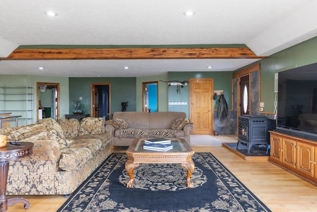 331 Gilman Rd, Sheldon, VT 05450 - living area with light wood finished floors, a wood stove, and recessed lighting