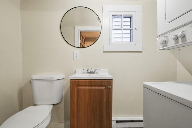 half bath featuring stacked washing machine and dryer, vanity, and toilet