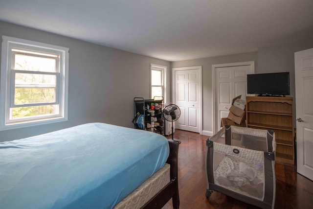 160A N Shore Rd, Derry, NH 03038 - bedroom featuring multiple closets and dark wood-style floors