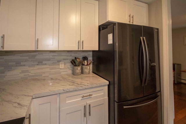 160A N Shore Rd, Derry, NH 03038 - kitchen with freestanding refrigerator, backsplash, white cabinets, and light stone countertops