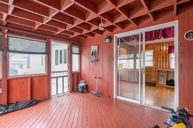 unfurnished sunroom with beam ceiling and coffered ceiling