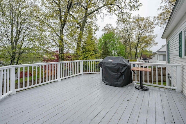 wooden deck featuring grilling area