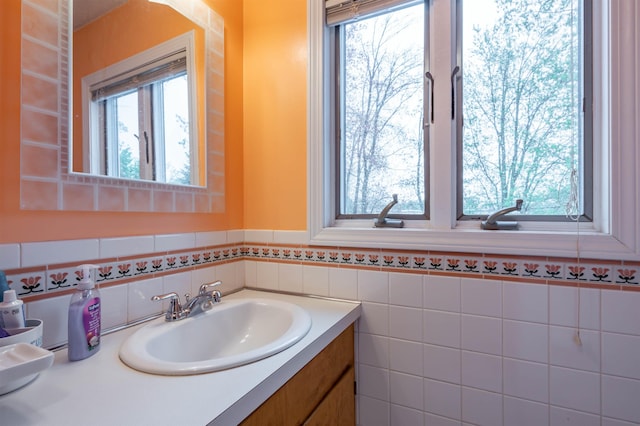 bathroom featuring healthy amount of natural light and vanity