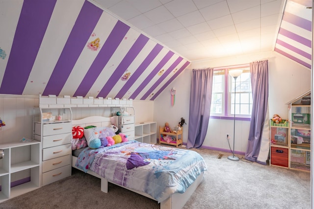 bedroom with lofted ceiling and carpet floors